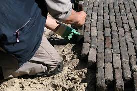 E.K. Bestratingen Wegenbouw en Grondwerken logo